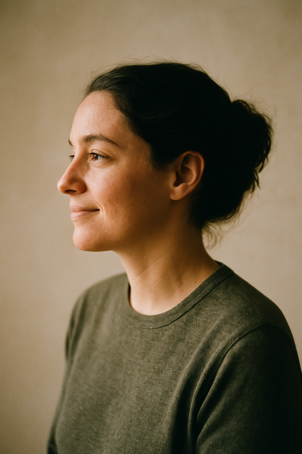A calm profile portrait in warm natural light